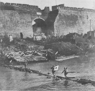 Japanese soldiers crossing the moat close to Zhonghua Gate on Nanking's southern side